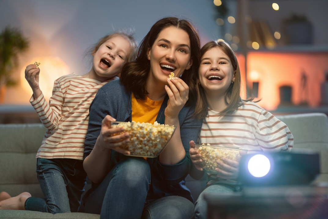 family watching tv commercial